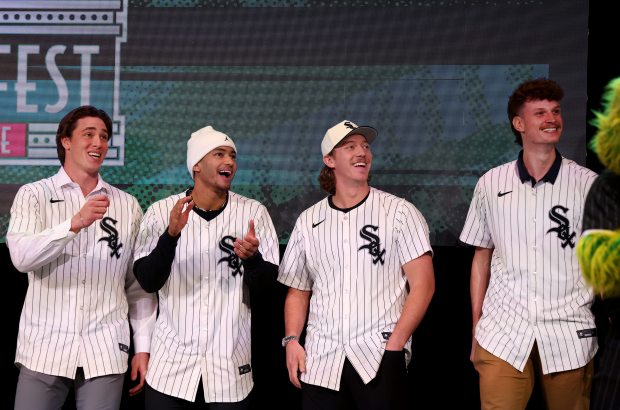 White Sox prospects, from left, George Wolkow, Braden Montgomery, Hagen Smith and Noah Schultz have a laugh as players are introduced during SoxFest on Jan. 25, 2025, at the Ramova Theatre. (Chris Sweda/Chicago Tribune)