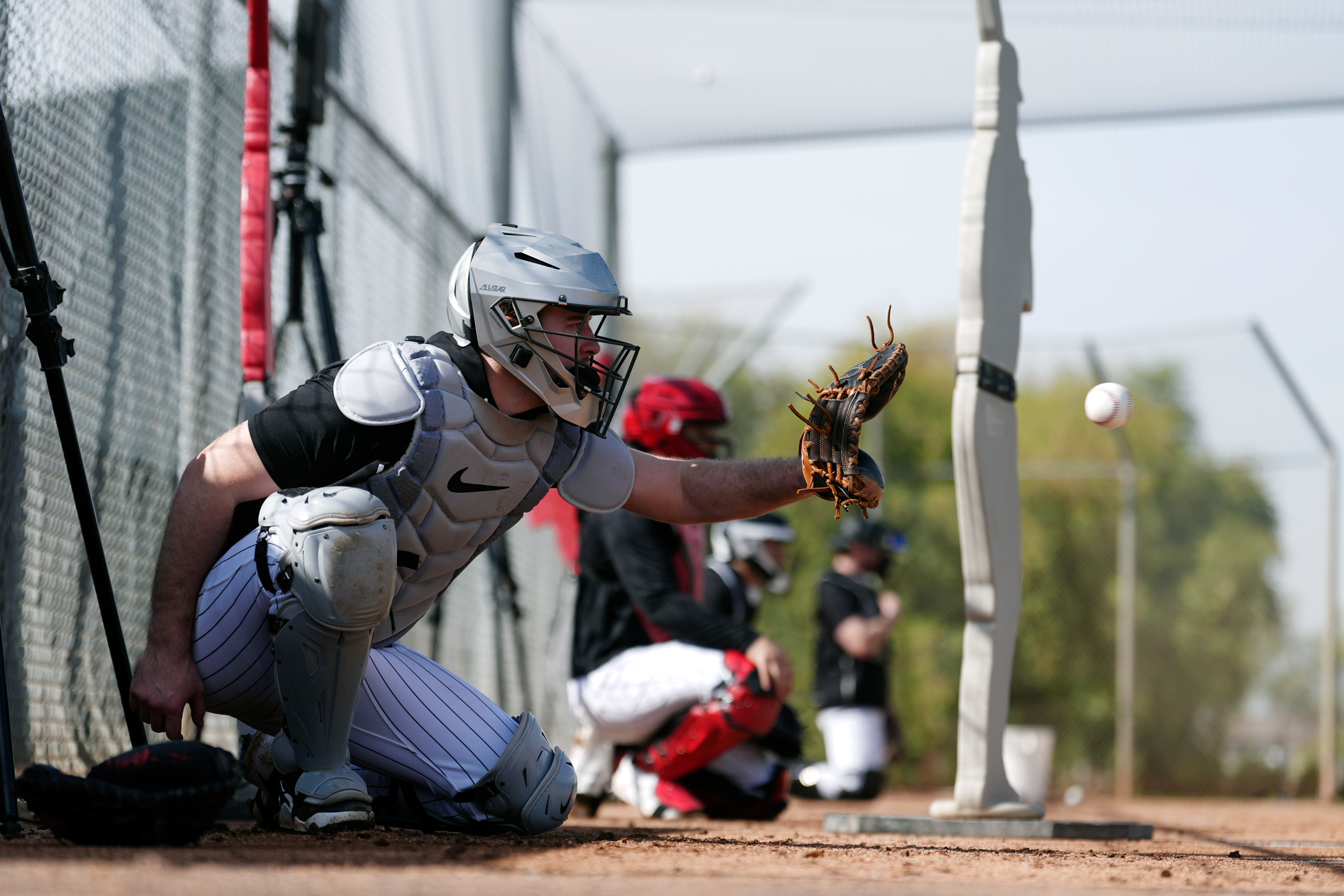 White Sox catcher Kyle Teel reaches for a baseball during...