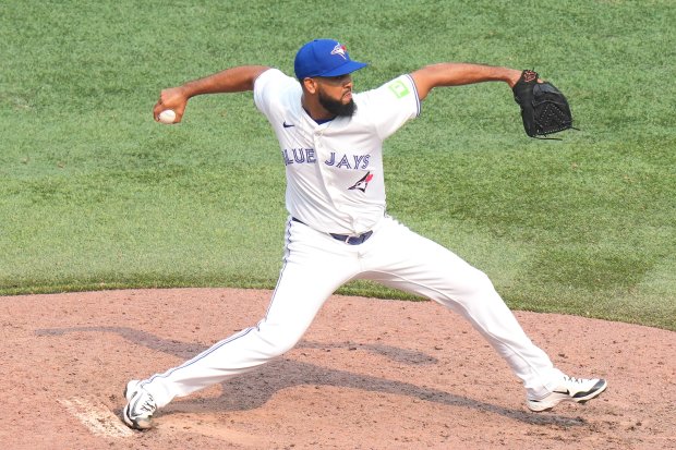 Toronto Blue Jays pitcher Seranthony Domínguez works against the Kansas City Royals in Toronto, Sunday Aug. 3, 2025. (Chris Young/The Canadian Press via AP)