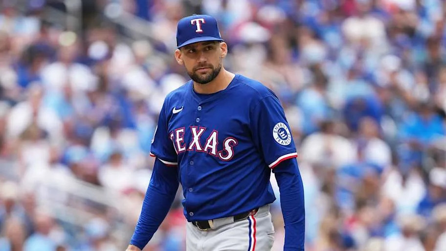 Texas Rangers starting pitcher Nathan Eovaldi walks off the field. 