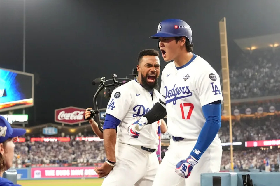 Oct 27, 2025; Los Angeles, California, USA; Los Angeles Dodgers two-way player Shohei Ohtani (17) celebrates with right fielder Teoscar Hernandez (37) after a solo home run against the Toronto Blue Jays in the seventh inning during game three of the 2025 MLB World Series at Dodger Stadium. Mandatory Credit: Kirby Lee-Imagn Images