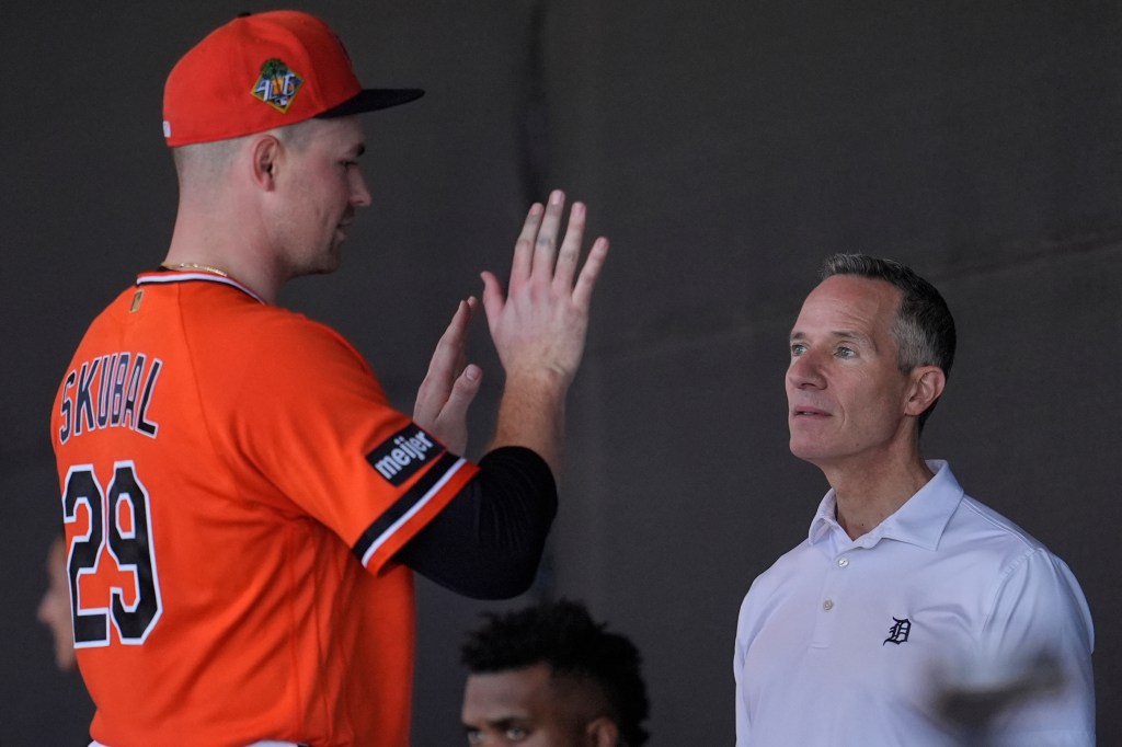 Detroit Tigers owner Chris Ilitch speaks with pitcher Tarik Skubal during spring training workouts.