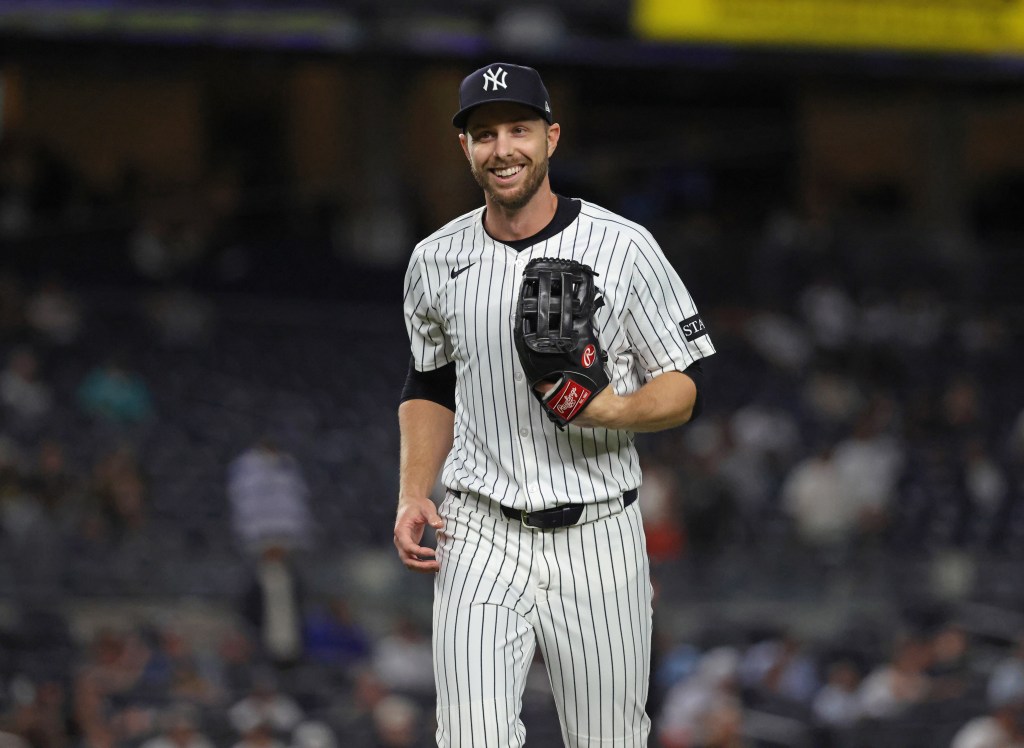 New York Yankees Austin Slater #29 smiling after pitching in the 9th inning.