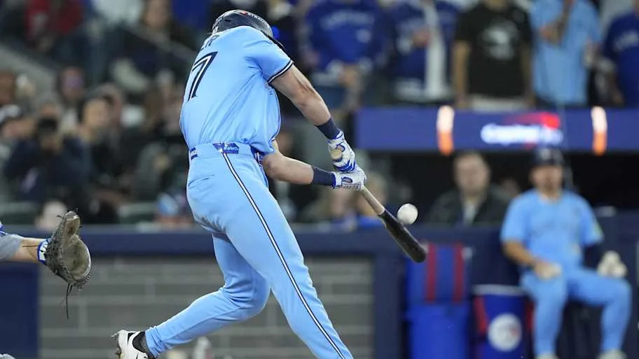 Barger hits a double against the Dodgers in a baby blue unifor