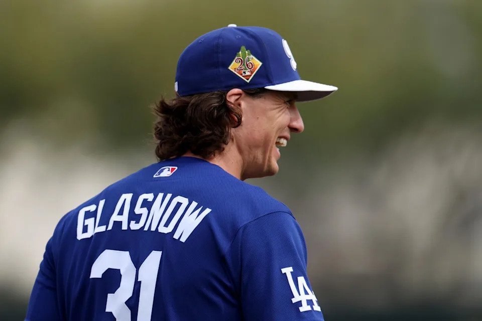 Dodgers pitcher Tyler Glasnow laughs while walking across the field at Dodgers spring training in Arizona on Monday.