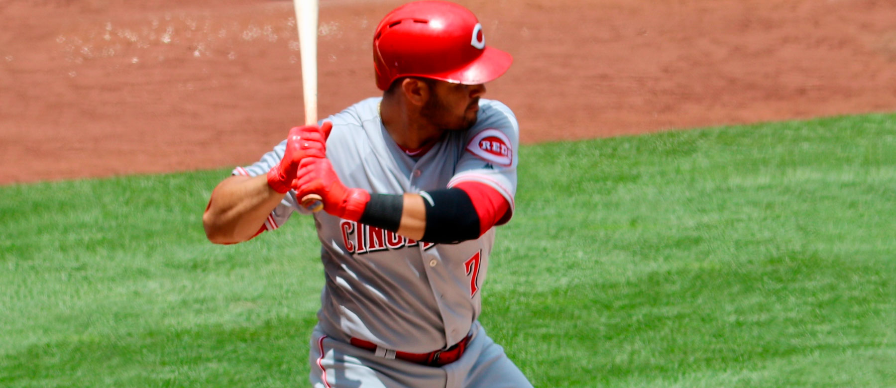 How much did adding a slugger improve the Reds offense?