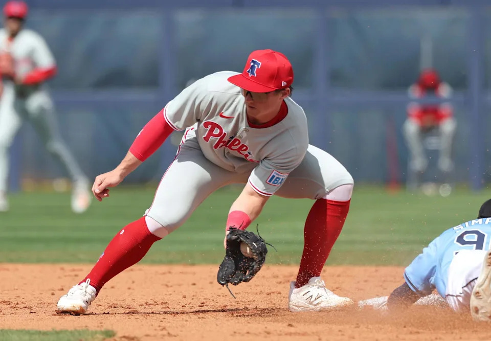 Feb 25, 2025; Port Charlotte, Florida, USA; Tampa Bay Rays outfielder Chandler Simpson (96) slides safely into second base against Philadelphia Phillies infielder Aidan Miller (81) at Charlotte Sports Park. Mandatory Credit: Kim Klement Neitzel-Imagn Images