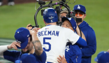 Oct 27, 2025; Los Angeles, California, USA; Los Angeles Dodgers first baseman Freddie Freeman (5) celebrates with manager Dave Roberts (30) after hitting a walk off home run in the eighteenth inning against the Toronto Blue Jays during game three of the 2025 MLB World Series at Dodger Stadium. Mandatory Credit: Kirby Lee-Imagn Images