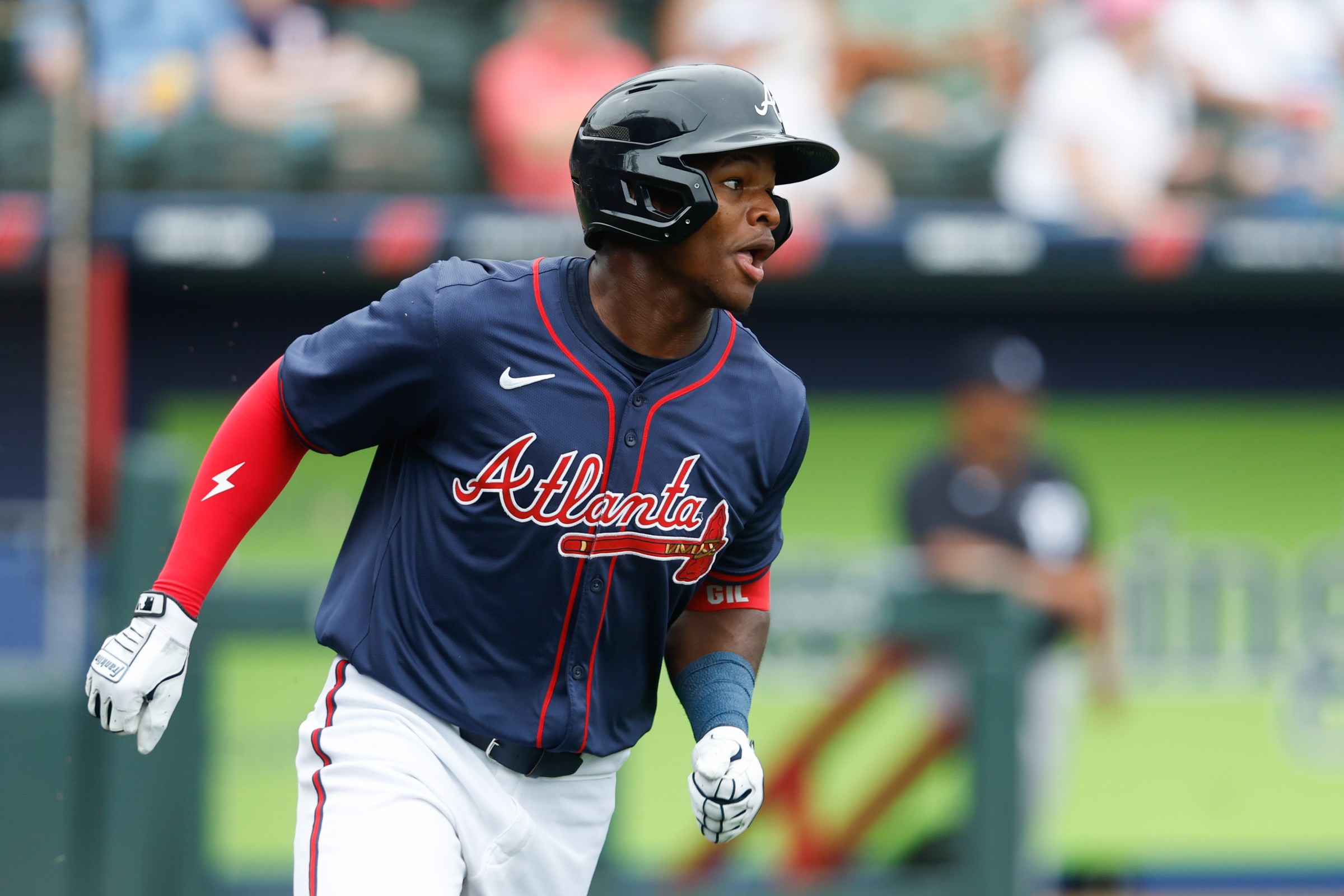 NORTH PORT, FL - MARCH 16: John Gil #97 of the Atlanta Braves runs to first base during the game between the Detroit Tigers and the Atlanta Braves at CoolToday Park on Sunday, March 16, 2025 in North Port, Florida. (Photo by Scott Audette/MLB Photos via Getty Images)