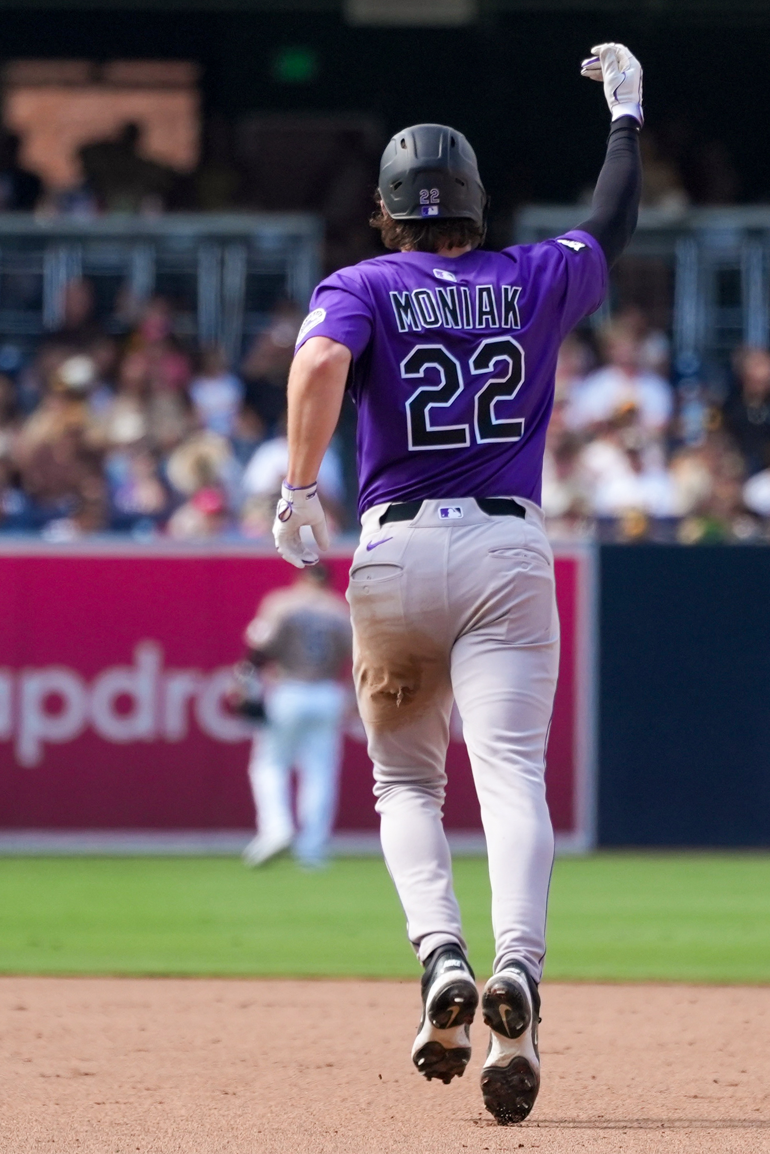 SAN DIEGO, CA - SEPTEMBER 14: Mickey Moniak #22 of the Colorado Rockies reacts after hitting a three-run home run in the sixth inning of the game between the Colorado Rockies and the San Diego Padres at Petco Park on Sunday, September 14, 2025 in San Diego, California. (Photo by Ryan Levy/MLB Photos via Getty Images)
