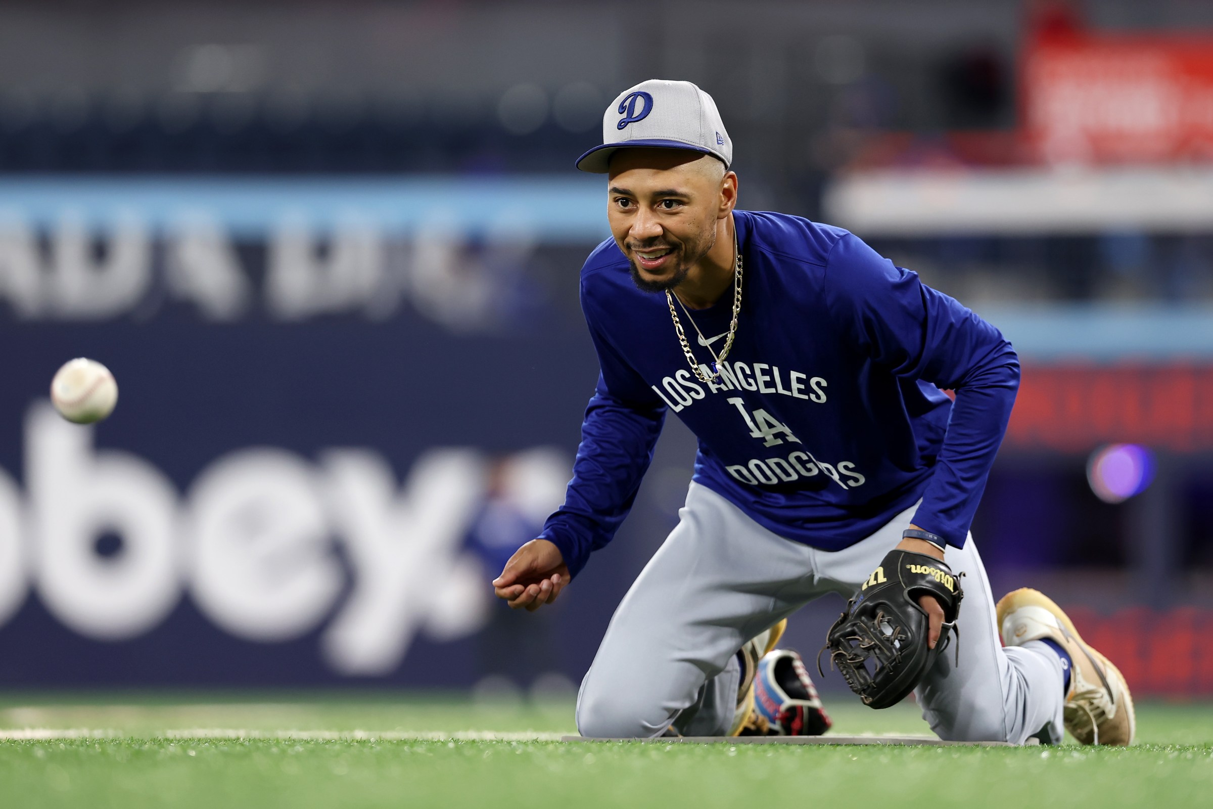 TORONTO, ONTARIO - NOVEMBER 01: Mookie Betts #50 of the Los Angeles Dodgers warms up before the game against the Toronto Blue Jays in game seven of the 2025 World Series at Rogers Center on November 01, 2025 in Toronto, Ontario. (Photo by Emilee Chinn/Getty Images)