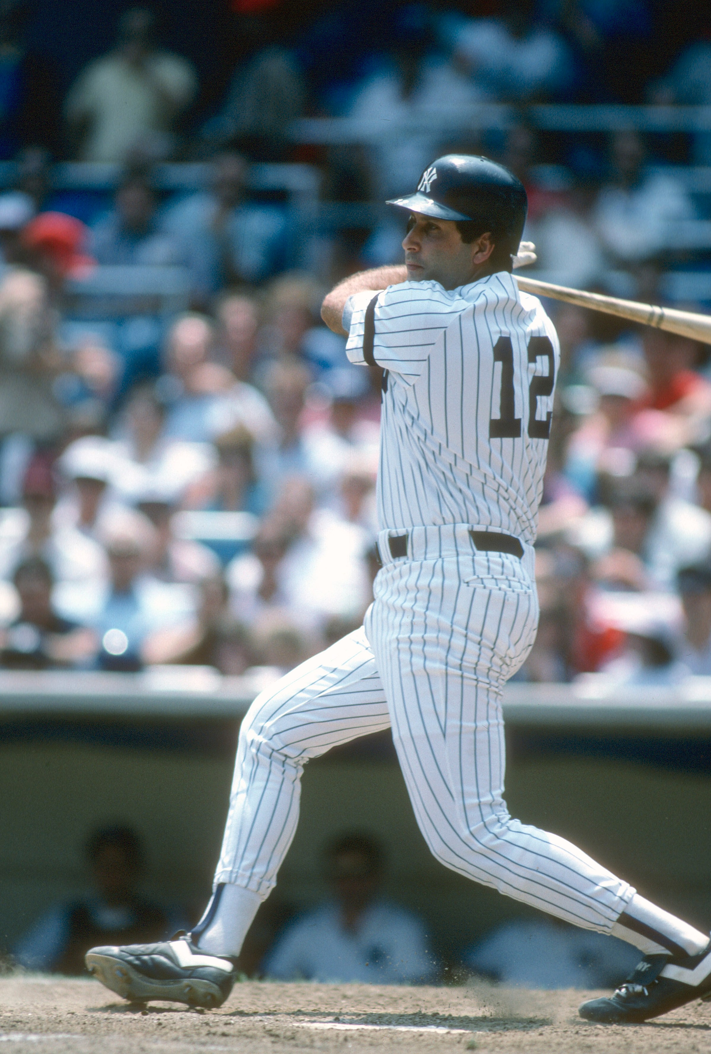 NEW YORK - CIRCA 1986: Ron Hassey #12 of the New York Yankees bats during a Major League Baseball game circa 1986 at Yankee Stadium in the Bronx borough of New York City. Hassey played for the Yankees from 1985-86. (Photo by Focus on Sport/Getty Images)