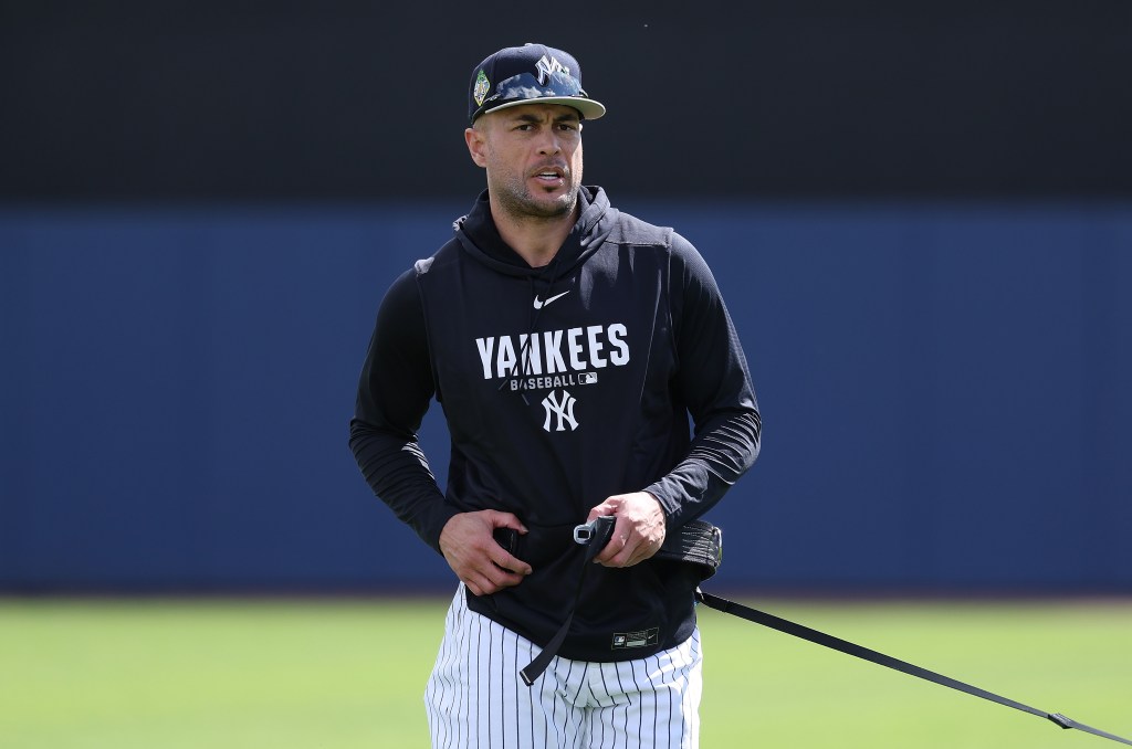 Giancarlo Stanton #27 of the New York Yankees warms up during team workouts.