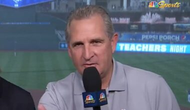 Glen Kuiper holds a mic