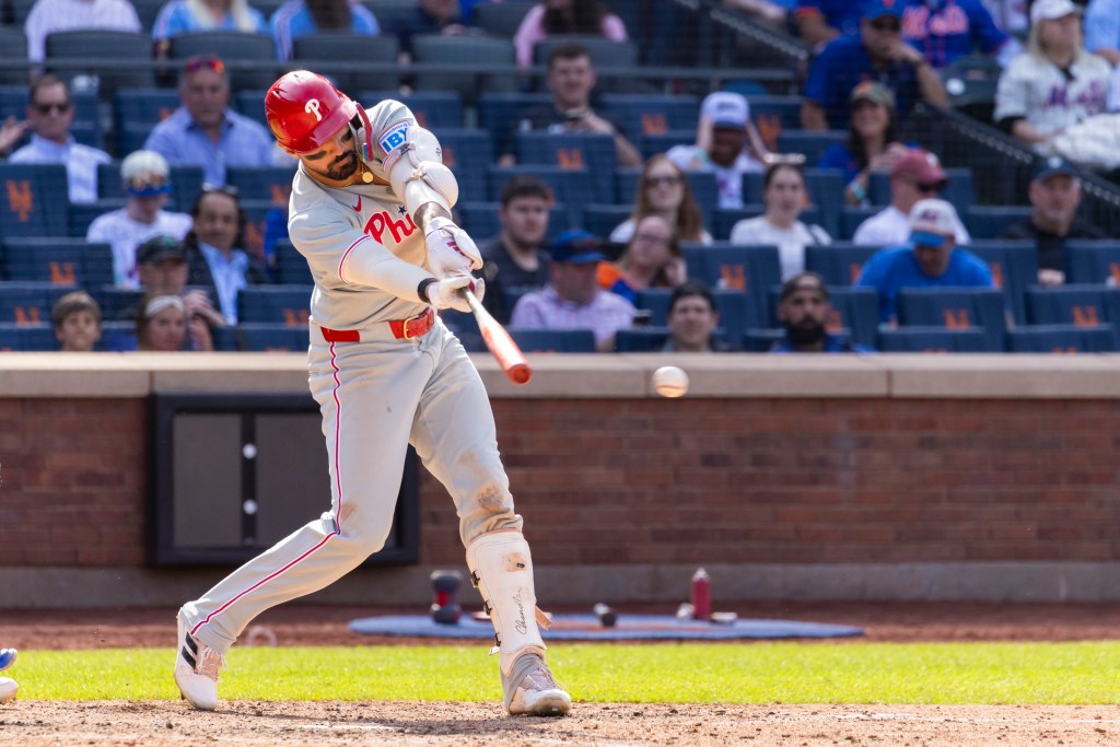 Philadelphia Phillies outfielder Nick Castellanos (8) hits an RBI single driving home Philadelphia Phillies first base Bryce Harper (3) gives the Phillies the lead in the 10th inning against the New York Mets at Citi Field, Wednesday, April 23, 2025, in Queens, NY.