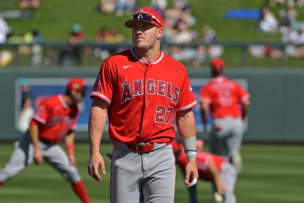 Los Angeles Angels center fielder Mike Trout (27) brings his gear to the dugout for the game against the Arizona Diamondbacks at Salt River Fields at Talking Stick.