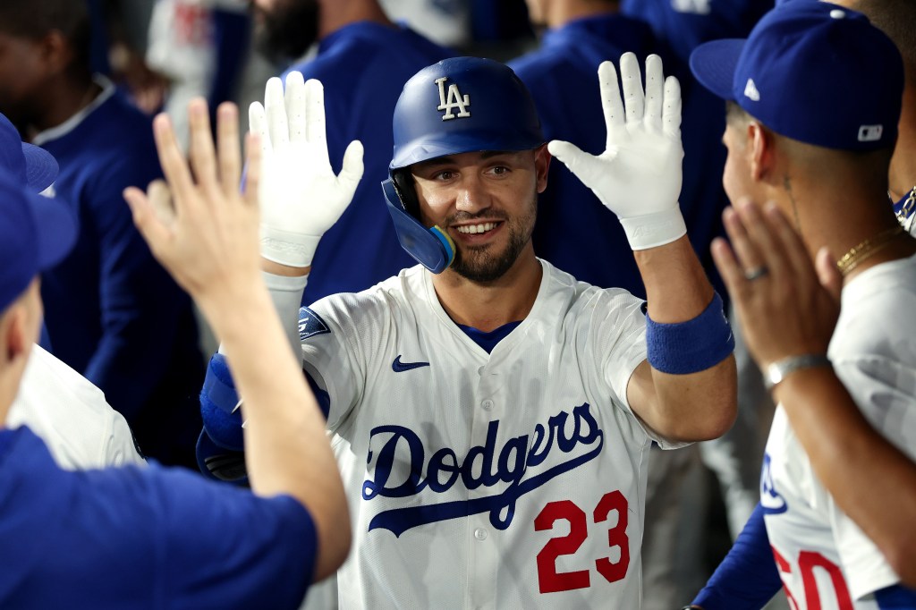 LOS ANGELES, CALIFORNIA - AUGUST 27: Michael Conforto #23 of the Los Angeles Dodgers reacts after hitting a solo home run  against the Cincinnati Reds during the eighth inning at Dodger Stadium on August 27, 2025 in Los Angeles, California. (Photo by Luke Hales/Getty Images)

