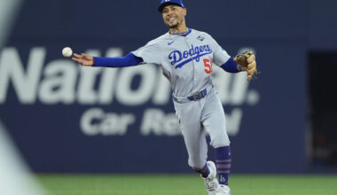 Nov 1, 2025; Toronto, Ontario, CAN; Los Angeles Dodgers shortstop Mookie Betts (50) throws to first for an out against Toronto Blue Jays third baseman Ernie Clement (22) in the fourth inning during game seven of the 2025 MLB World Series at Rogers Centre. Mandatory Credit: John E. Sokolowski-Imagn Images