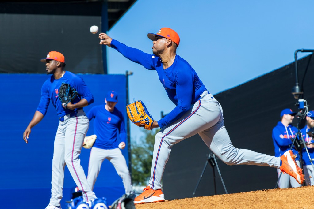 New York Mets pitcher Freddy Peralta throws a bullpen session during Spring Training.