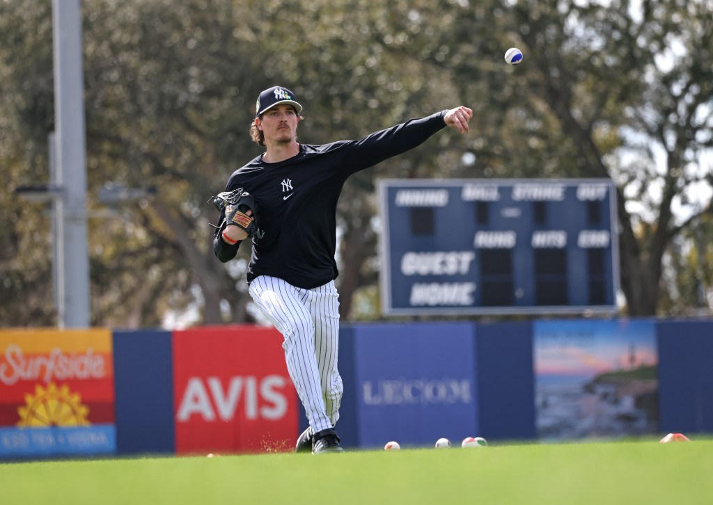 New York Yankees pitcher Max Fried #54 throws a ball with blue paint during a workout at Steinbrenner Field.