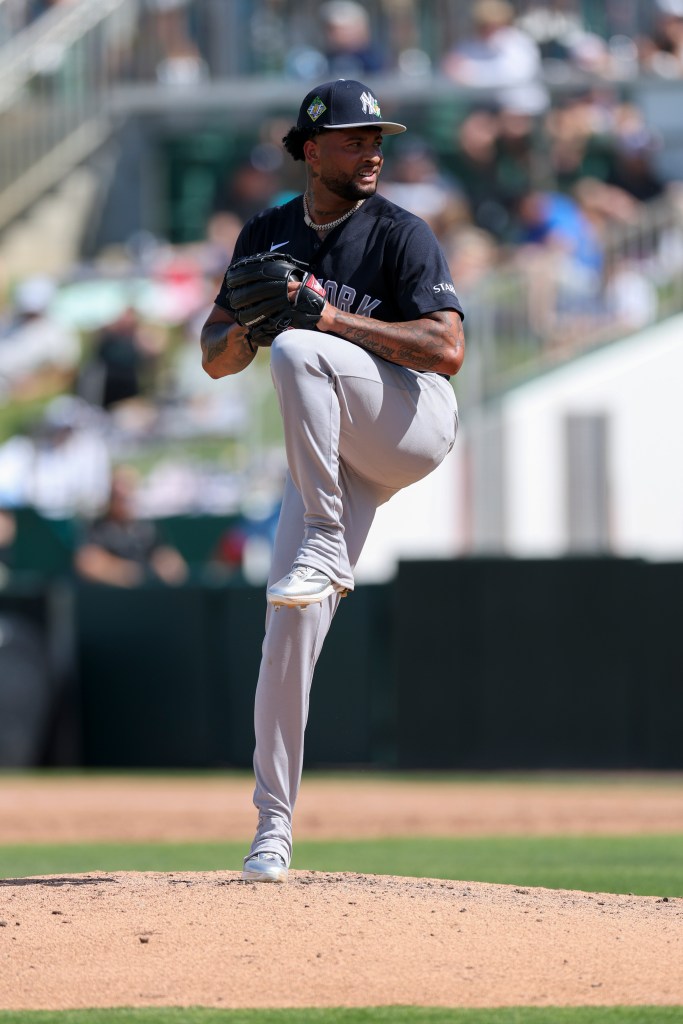 New York Yankees pitcher Luis Gil in a pre-pitch stance on the mound.