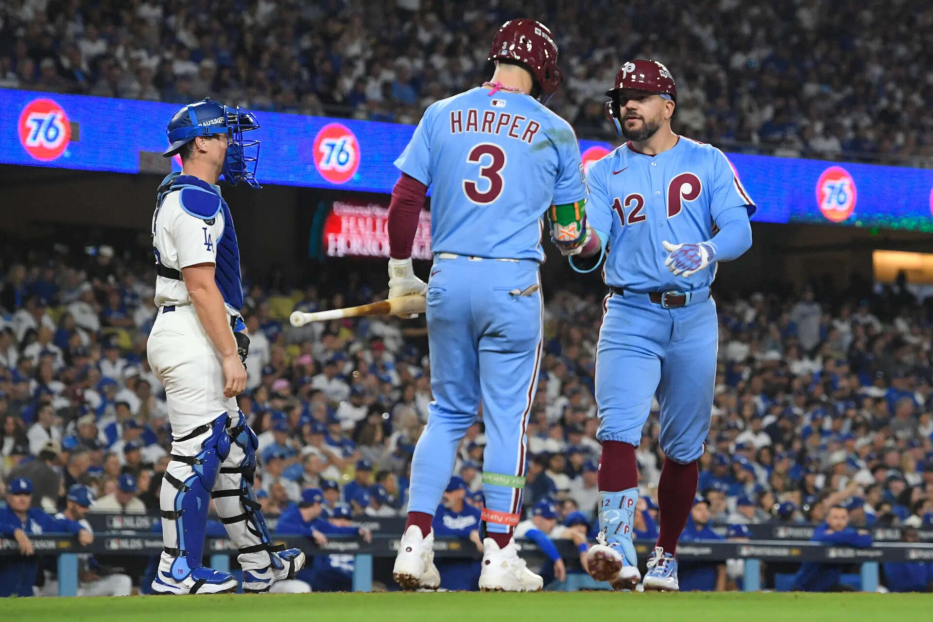 Philadelphia Phillies' Kyle Schwarber, right, is met a home plate by Bryce Harper (3) after Schwarber's solo home run (Image via AP Photo) NLDS Phillies Dodgers Baseball