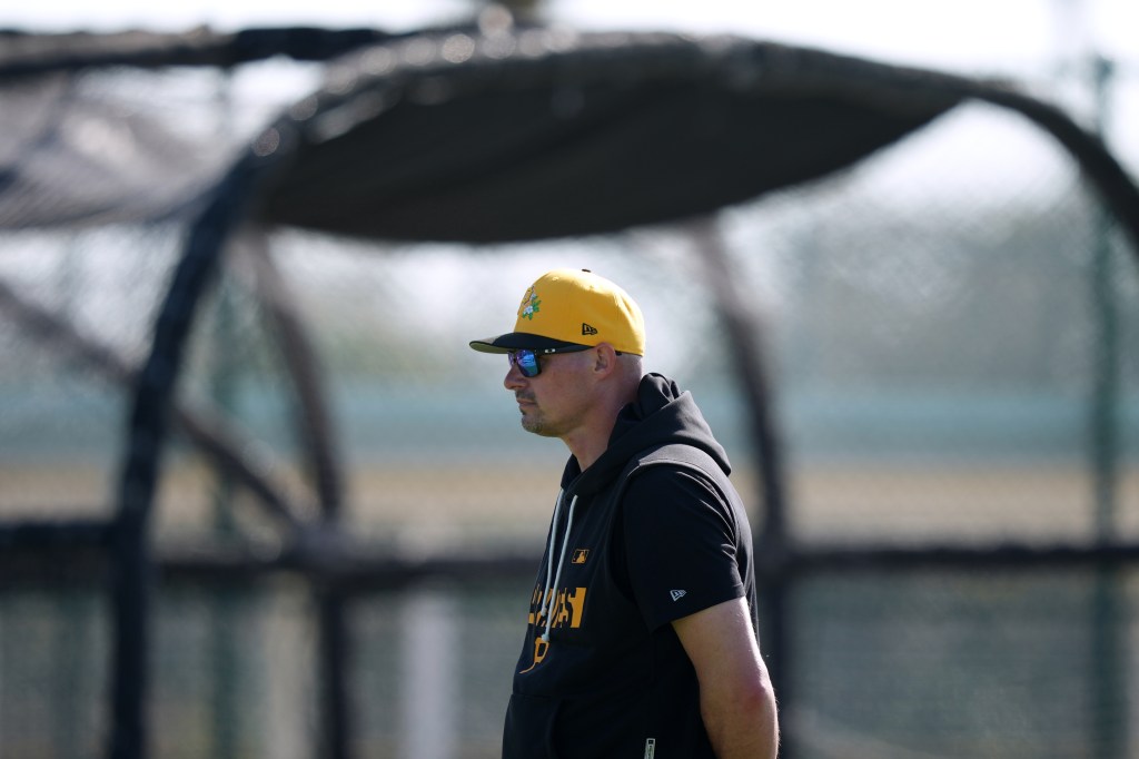 Pittsburgh Pirates manager Don Kelly watches a workout during spring training.