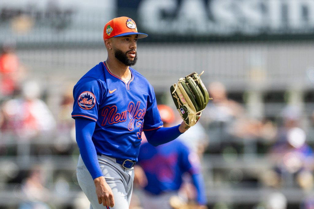 New York Mets Pitcher Devin Williams (38) reacts to a home run.