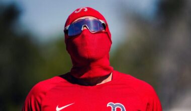 Boston Red Sox first baseman Triston Casas (36) wore a protective coverup from the suns rays. Casas was in camp early before position players are required to report for Boston Red Sox Spring Training at Jet Blue Park in Fort Myers, FL.