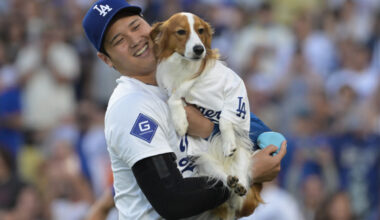 Aug 28, 2024; Los Angeles, California, USA; Los Angeles Dodgers designated hitter Shohei Ohtani (17) with his dog Decoy after he delivered he first pitch before the game against the Baltimore Orioles at Dodger Stadium. Mandatory Credit: Jayne Kamin-Oncea-USA TODAY Sports