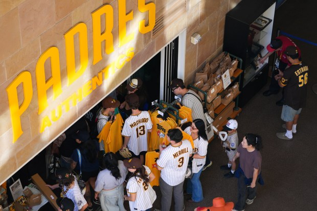 Padres fans stop at the merchandise store during FanFest 2026 at Petco Park on Saturday, Jan. 31, 2026.  (Nelvin C. Cepeda / The San Diego Union-Tribune)
