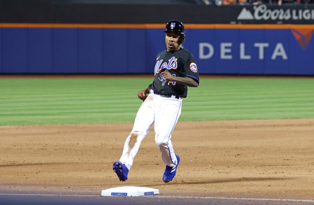 Terrance Gore #4 of the New York Mets moving to third base after stealing second.