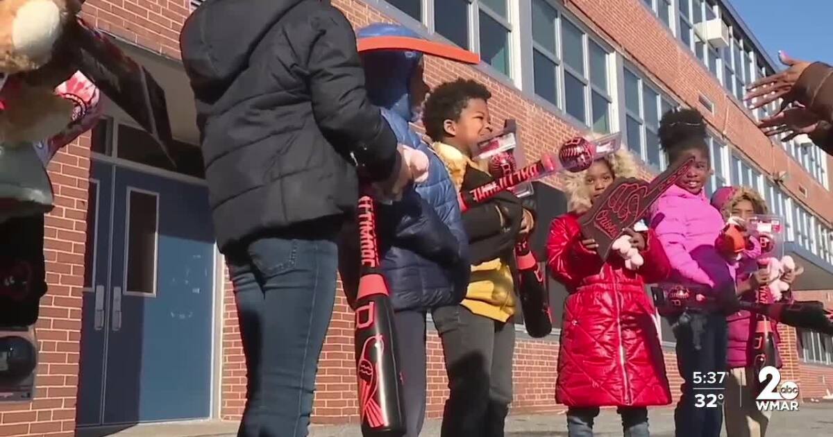 Orioles surprise students celebrating academic improvement at Harlem Park
