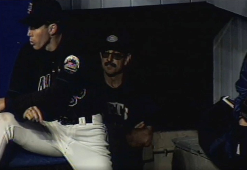 Bobby Valentine in the dugout wearing a hat, sunglasses, and a fake mustache as a disguise.