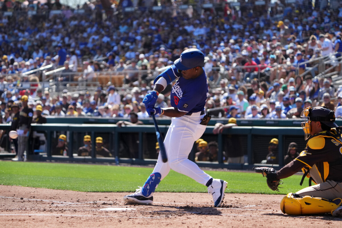 Feb 23, 2025; Phoenix, Arizona, USA; Los Angeles Dodgers right fielder Zyhir Hope (94) hits an RBI against the San Diego Padres during the second inning at Camelback Ranch-Glendale. Mandatory Credit: Joe Camporeale-Imagn Images