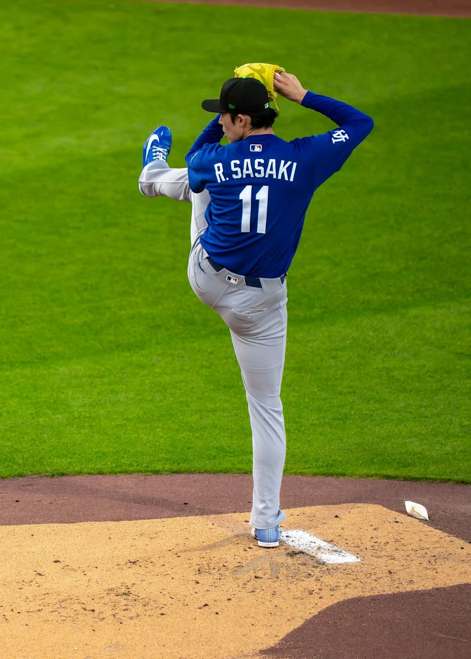Los Angeles Dodgers pitcher Roki Sasaki (11) pitching during an MLB spring training baseball game against the Kansas City Royals on March 17th, 2026 in Surprise, AZ.