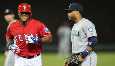 Apr 27, 2015; Arlington, TX, USA; Texas Rangers third baseman Adrian Beltre (29) runs past Seattle Mariners second baseman Robinson Cano (22) after called out for being hit with a live ball during the fourth inning at Globe Life Park in Arlington. Mandatory Credit: Jerome Miron-Imagn Images