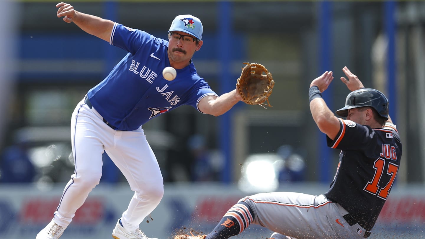 Mar 8, 2026; Dunedin, Florida, USA; Detroit Tigers first baseman Jace Jung (17) slips safely into second base in front of Toronto Blue Jays second baseman Davis Schneider (36) in the second inning during spring training at TD Ballpark. Mandatory Credit: Nathan Ray Seebeck-Imagn Images