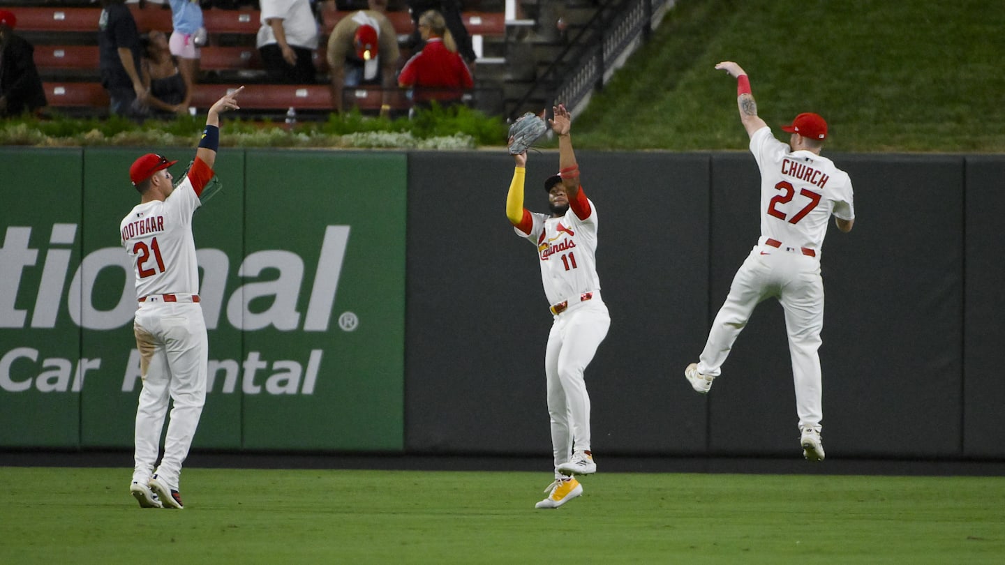 Sep 2, 2025; St. Louis, Missouri, USA;  St. Louis Cardinals outfielder Lars Nootbaar (21) center fielder Victor Scott II (11) and right fielder Nathan Church (27) celebrate after the Cardinals defeated the Athletics at Busch Stadium. Mandatory Credit: Jeff Curry-Imagn Images