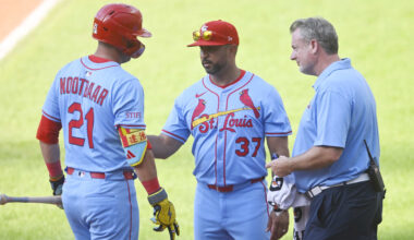 Jun 28, 2025; Cleveland, Ohio, USA; St. Louis Cardinals manager Oliver Marmol (37)(right) and assistant athletic trainer Chris Conroy talk to left fielder Lars Nootbaar (21)(left) after he was hit by a foul ball in the ninth inning against the Cleveland Guardians at Progressive Field. Mandatory Credit: David Richard-Imagn Images