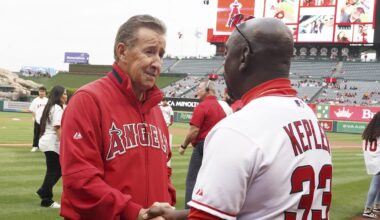 May 24, 2023; Anaheim, California, USA; Los Angeles Angels owner Arte Moreno shakes hands with Tim Keppler during the game against the Boston Red Sox  at Angel Stadium. Mandatory Credit: Kirby Lee-Imagn Images