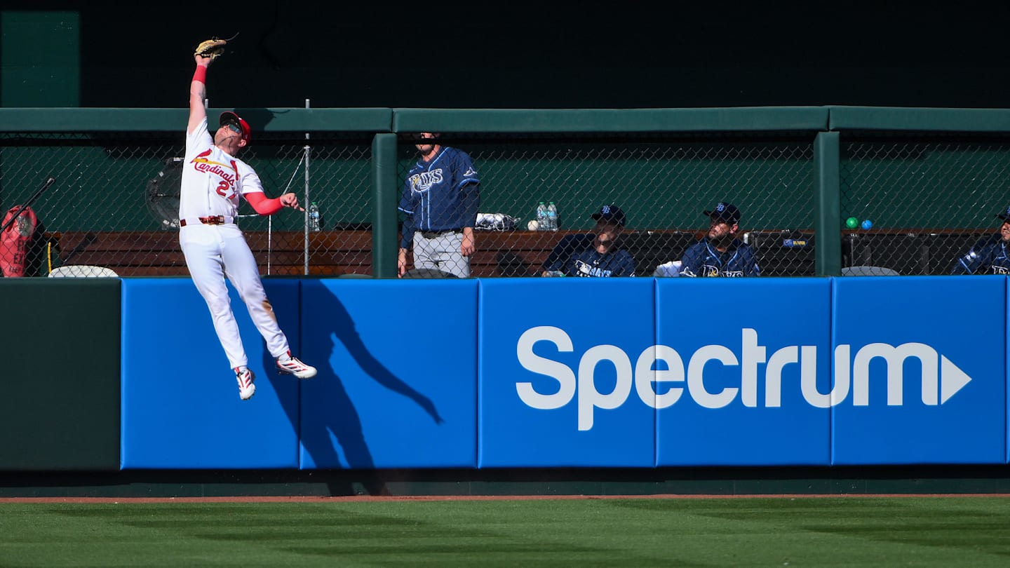 Mar 26, 2026; St. Louis, Missouri, USA; St. Louis Cardinals left fielder Nathan Church (27) leaps at the wall and robs a home run from Tampa Bay Rays left fielder Ryan Vilade (not pictured) during the fifth inning at Busch Stadium. Mandatory Credit: Jeff Curry-Imagn Images