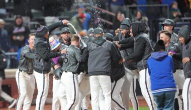 Mar 28, 2026; New York City, New York, USA; New York Mets center fielder Luis Robert Jr. (88) gets dosed with water as  teammates mob in celebration of getting a three run walk off home run Pittsburgh Pirates first baseman Spencer Horwitz (2) during the eleventh inning at Citi Field. Mandatory Credit: Gregory Fisher-Imagn Images