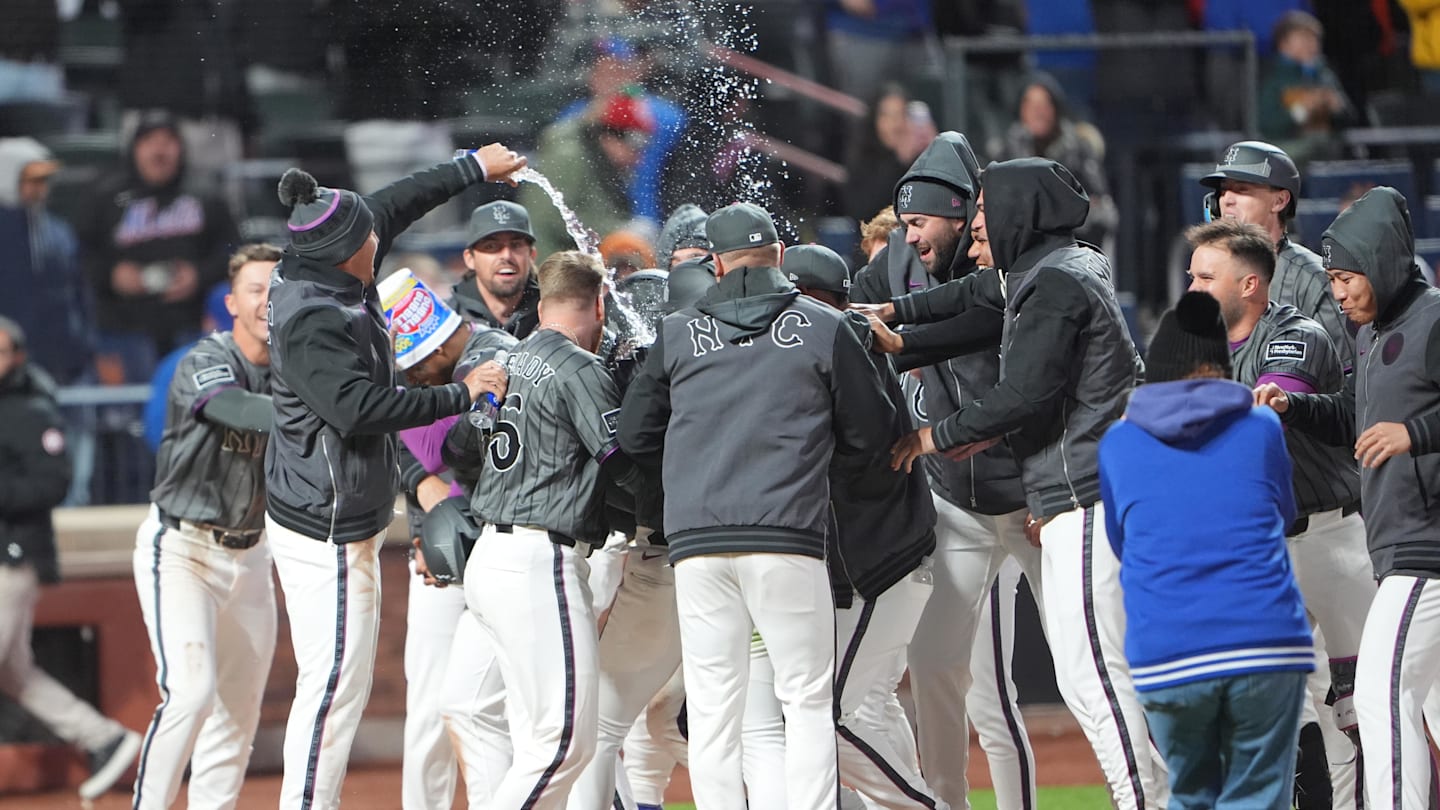 Mar 28, 2026; New York City, New York, USA; New York Mets center fielder Luis Robert Jr. (88) gets dosed with water as  teammates mob in celebration of getting a three run walk off home run Pittsburgh Pirates first baseman Spencer Horwitz (2) during the eleventh inning at Citi Field. Mandatory Credit: Gregory Fisher-Imagn Images
