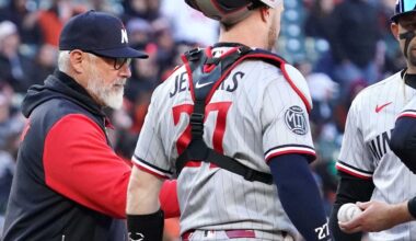 Mar 28, 2026; Baltimore, Maryland, USA; Minnesota Twins pitcher Kody Funderburk (center) hands the ball to manager Derek Shelton (left) and is removed from the game during the sixth inning against the Baltimore Orioles at Oriole Park at Camden Yards. Mandatory Credit: Mitch Stringer-Imagn Images