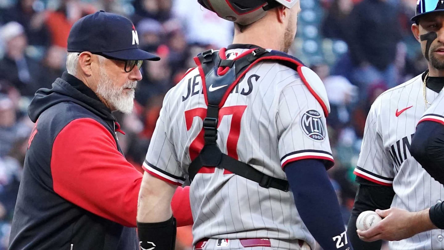 Mar 28, 2026; Baltimore, Maryland, USA; Minnesota Twins pitcher Kody Funderburk (center) hands the ball to manager Derek Shelton (left) and is removed from the game during the sixth inning against the Baltimore Orioles at Oriole Park at Camden Yards. Mandatory Credit: Mitch Stringer-Imagn Images