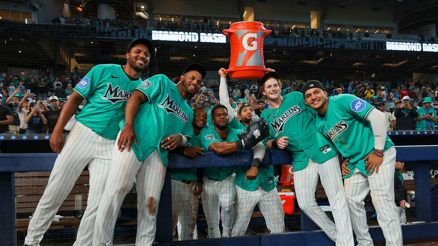 Mar 29, 2026; Miami, Florida, USA; Miami Marlins right fielder Owen Caissie (17) poses for a photo with pitcher Michael Petersen (49), first baseman Deyvison de Los Santos (63), second baseman Xavier Edwards (9), shortstop Otto Lopez (6), catcher Agustin Ramirez (50), and third baseman Javier Sanoja (8) after hitting a two-run walk-off home run against the Colorado Rockies during the ninth inning at loanDepot Park. Mandatory Credit: Sam Navarro-Imagn Images