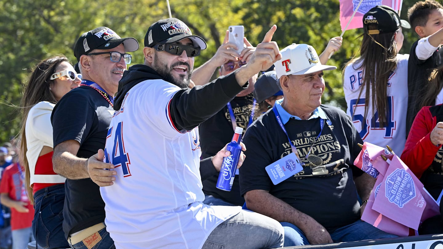 Nov 3, 2023; Arlington, TX, USA; Texas Rangers starting pitcher Martin Perez (54) during the World Series championship parade at Globe Life Field. Mandatory Credit: Jerome Miron-Imagn Images