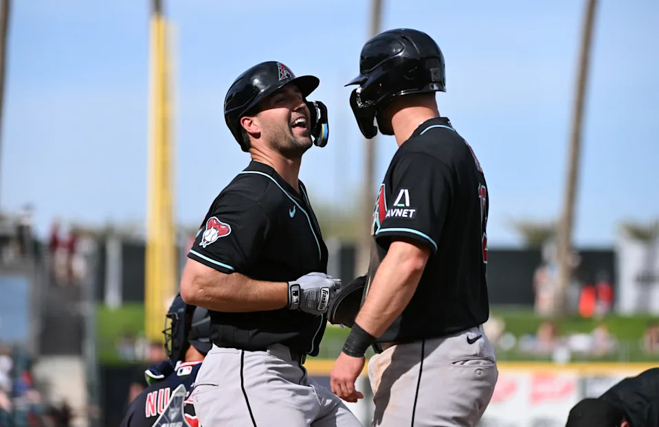 Ryan Waldschmidt #86 of the Arizona Diamondbacks celebrates with Tim Tawa #13 after hitting a two-run home run against the Cleveland Guardians during the seventh inning of a spring training game at Goodyear Ballpark on Feb. 23, 2026, in Goodyear.