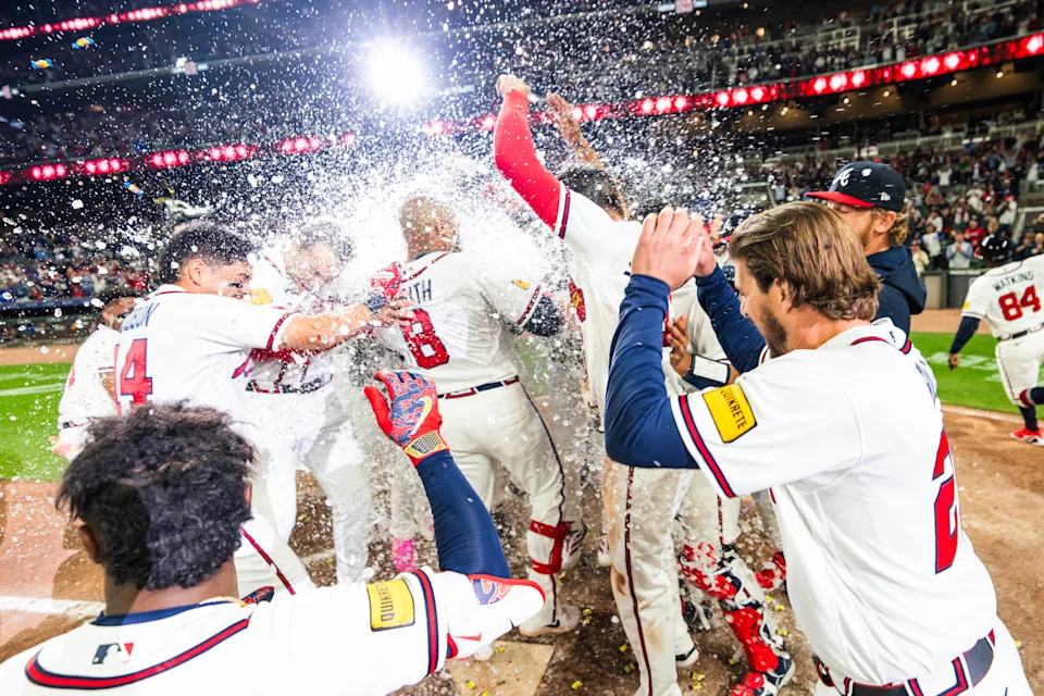 ATLANTA, GA - MARCH 28: Dominic Smith #8 of the Atlanta Braves and teammates celebrate Smith's walk-off grand slam during the ninth inning against the Kansas City Royals at Truist Park on March 28, 2026 in Atlanta, Georgia. (Kevin D. Liles/Atlanta Braves/Getty Images)